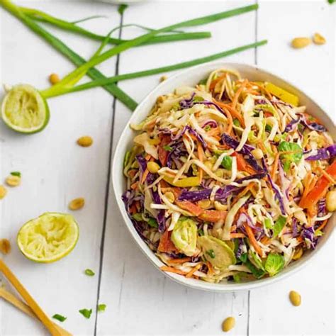 Asian Cabbage Slaw With Peanut Sesame Dressing Bites Of Wellness