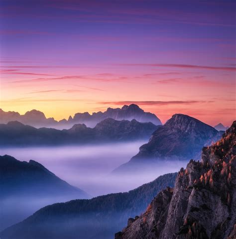 Premium Photo Mountains In Fog At Beautiful Sunset In Autumn In
