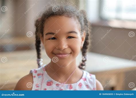cute curly haired girl smiling and looking happy stock image image of leisure cheerful 184965835