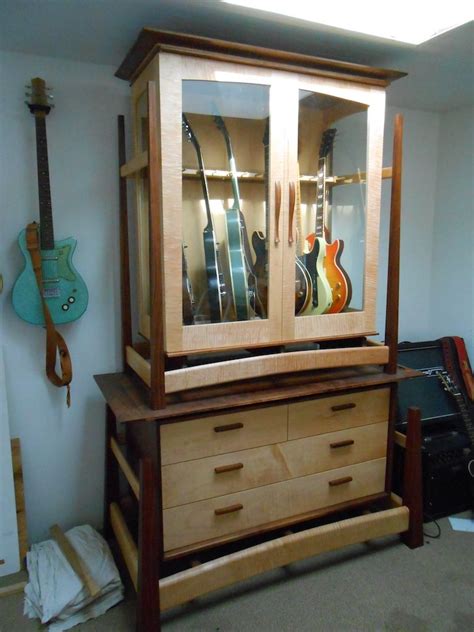 Ask a group of guitarists what their favorite instrument, amplifiers, and effects are, and each. Guitar Cabinet | Guitar humidifier, Guitar storage cabinet ...