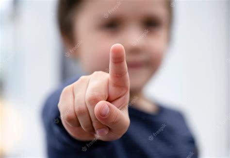 Premium Photo Blurry Face Of A Boy Finger Pointing At Camera School