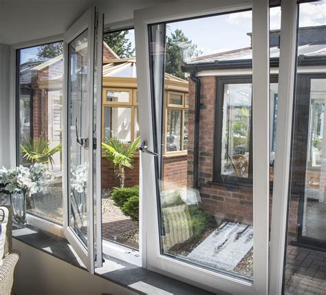 An Open Patio Door Leading To A Brick House