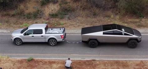 Watch Tesla Cybertruck In Tug Of War Against Ford F150 And Size