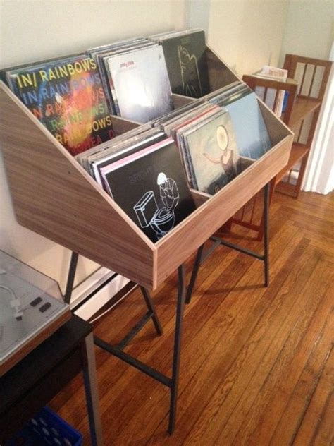 Traditional rack storage below and 'flip' browsing above, just like you would do in a record store. Vinyl record storage display holder. Don't hide your ...