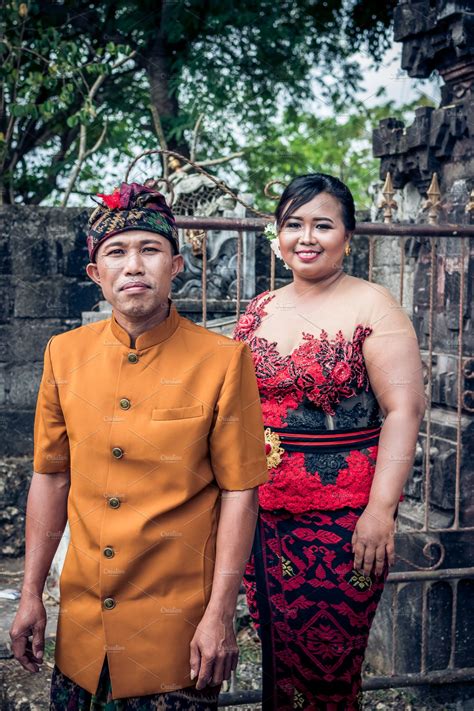 Lovely Honeymoon Balinese Couple In Traditional Clothes Together In