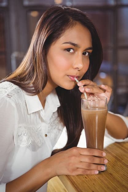 Premium Photo Portrait Of A Beautiful Woman Drinking A Hot Chocolate