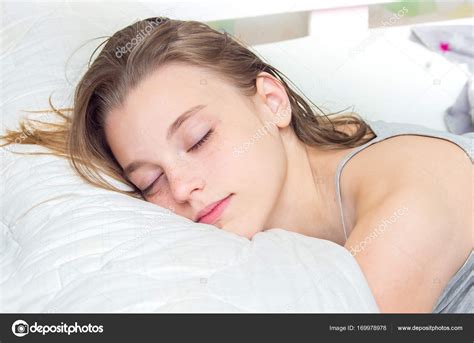 Beautiful Teen Girl Sleeping In Bed Portrait Stock Photo By