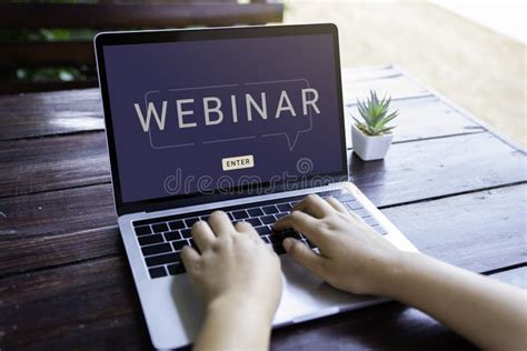 Person Using A Laptop Computer For Online Training Webinars Stock