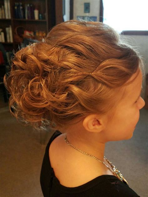 This fun updo hairstyle makes the little girl look very grown up and won't easily fall out. Little girl updo | Girls updo hairstyles, Pageant hair ...