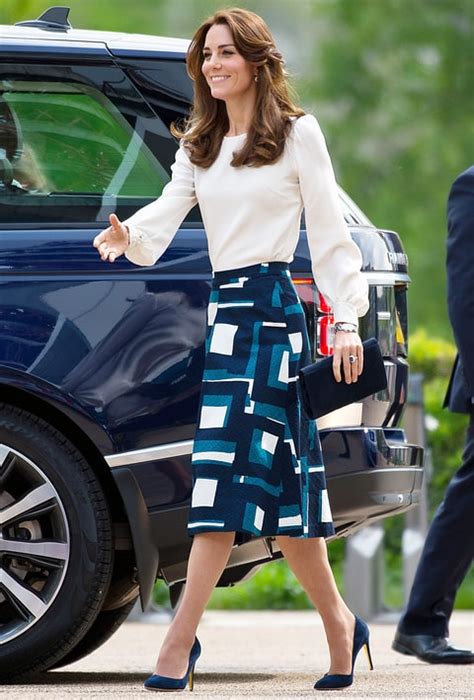 Kate Middleton Goes Boxing In White Blouse Midi Skirt Us Weekly