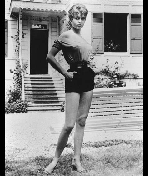 A Young Brigitte Bardot Poses For A Portrait Outside Her Home In 1958