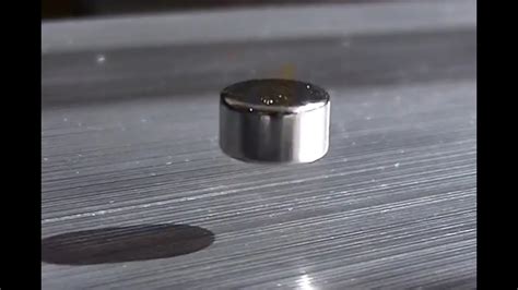 Neodymium Magnet Levitating Above A Block Of Aluminum Magnetic