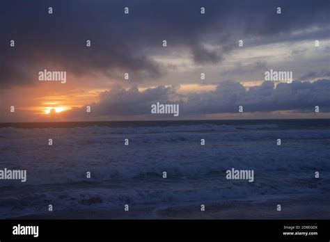 Cloudy Beach Sunrise Stock Photo Alamy