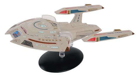 A Model Of A Star Trek Ship On A Black Stand