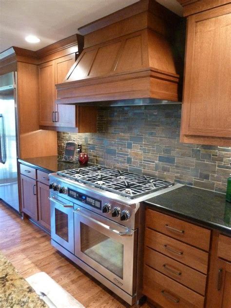 Ceramic tile or possibly stone in a expected pattern. 20 Kitchens With Stone Backsplash Designs