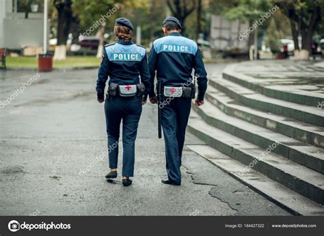 Police Walking On Street — Stock Photo © Tiko0305 184427322