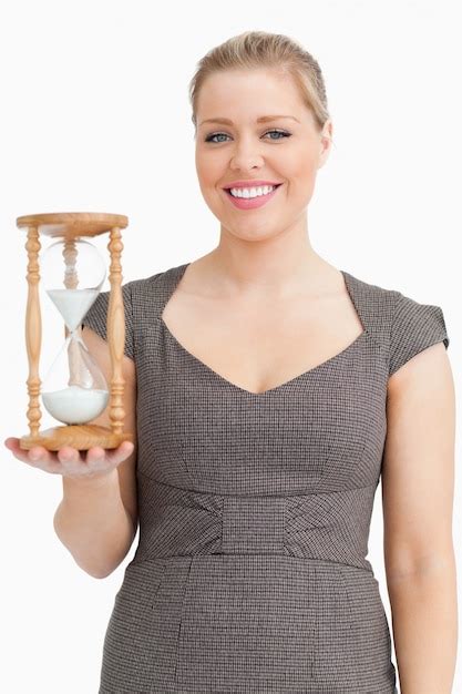 Premium Photo Woman Smiling While Holding A Hourglass