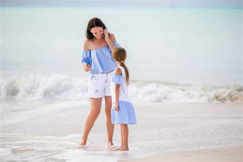 Premium Photo Beautiful Mother And Daughter On Caribbean Beach