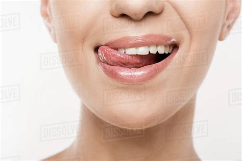 Cropped View Of Beautiful Woman Licking Lips Isolated On White Stock