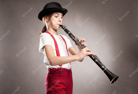 Premium Photo Little Girl Playing Clarinet