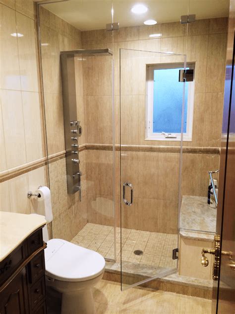 The corner chases became home to two recessed shower caddies on either side of a niche where a botticino marble bench resides. Steam Shower Doors - ShowerDoorPrices