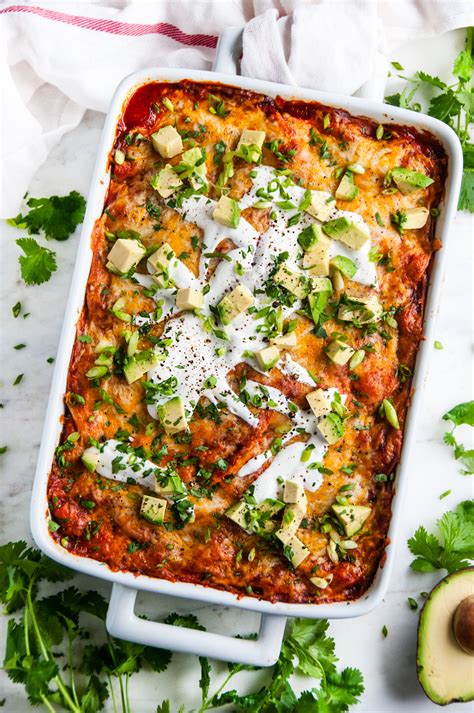 Repeat with a second layer but this time, go with another third of the sauce, the remainder of the chicken, the rest of the corn and black beans. Cheesy Red Chicken Enchilada Casserole - Aberdeen's Kitchen