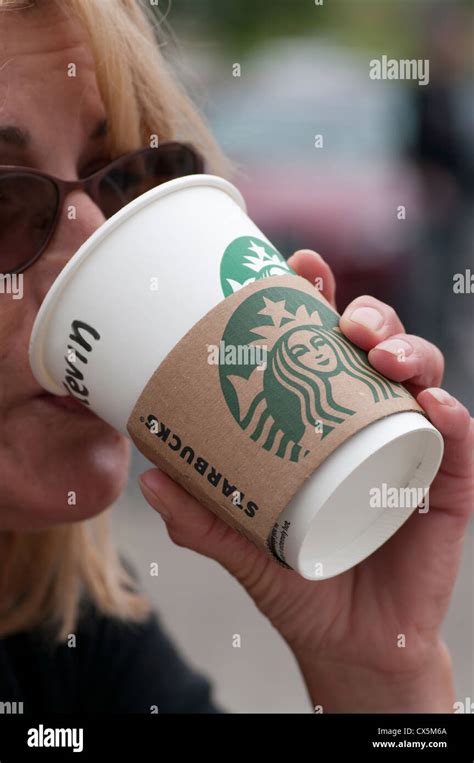 Woman Person Drinking Starbucks Coffee Stock Photo Alamy