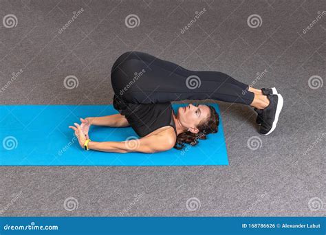 Strong And Sporty Fitness Woman In Black Sportswear Doing Abdominal