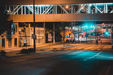 Street With Building With Overpass At Night · Free Stock Photo