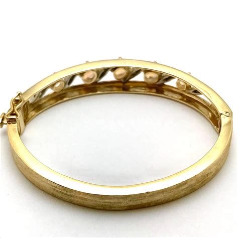 14 karat gold bangle bracelet. Jelly Opal and Diamond 14 Karat White and Yellow Gold ...