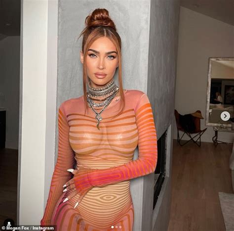 Megan Fox Puts On A Racy Display In A Sheer Orange Dress As She Flaunts Her Ample Assets In