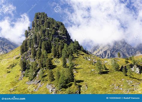 Clouds Over Sunny Mountainside Stock Photo Image Of Summits Rocky