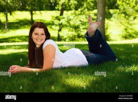 Portrait Of A Young Woman Laying On The Grass Wilmar Minnesota