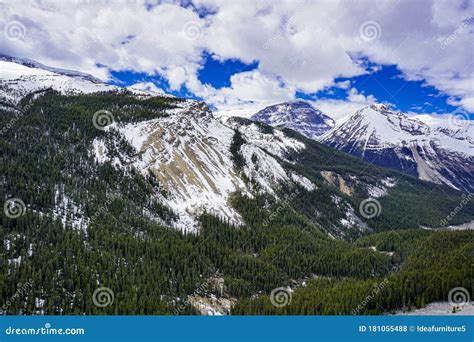 Snow Capped Canada S Rockies Mountain During A Summer Day Contrasting