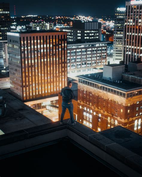 Man Standing On Rooftop Photo Free St Paul Image On Unsplash