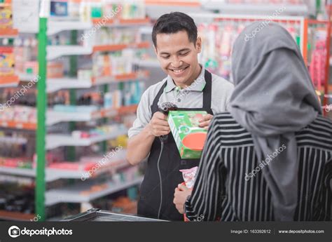 Male Shopkeeper Scanning Product Barcode Stock Photo By ©odua 163392612