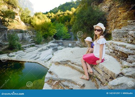 Two Cute Girls Exploring Papingo Rock Pools Also Called Ovires