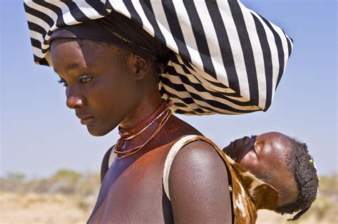 mucubal people angolan enduring tribe and their fashionable ompota headdress