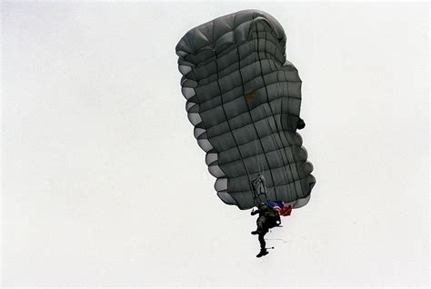 A Us Military Paratrooper Performs A Demonstration Parachute Jump