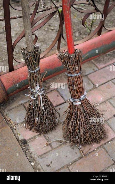 Two Homemade Broom Branches In The Yard Stock Photo Alamy