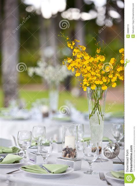 For an evening event, be aware of how a setting sun may blaze through windows, and be sure there is plenty of light for guests to enjoy dinner. Beach Wedding Decor Table Setting And Flowers Stock Photos ...