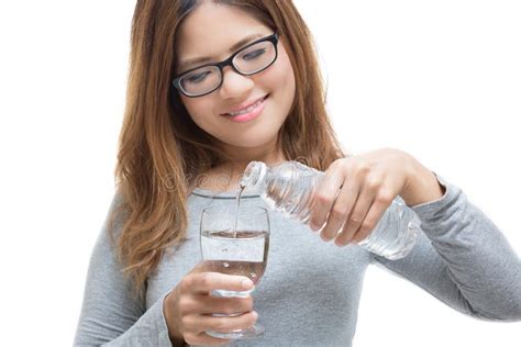 Young Woman Pouring Water Into A Glass Stock Photo Image Of