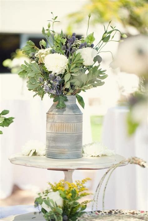 Rustic wedding bouquet with creamy roses, white carnations, and eustoma stand on the floor. Eucalyptus Lane Wedding by We Heart Photography | Rustic ...
