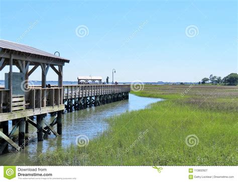 A Wooden Boardwalk Going Through Marsh Wetlands Stock Image Image Of