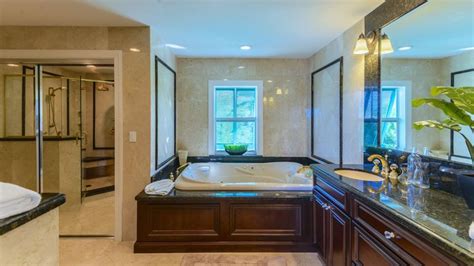 Hot tub with big dimensions, it's an outdoor jacuzzi manufactured by aquavia hot tub for 3 people sitting and 2 lying down. Master bathroom with large Jacuzzi tub | Residential ...