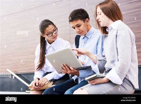 Teenage Students Having Project Discussion Stock Photo Alamy