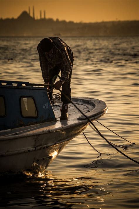 Fisherman On A Fishing Boat At Sunset Editorial Stock Image Image Of