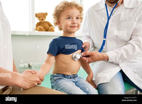 Smiling Little Boy At Medical Checkup Stock Photo Alamy