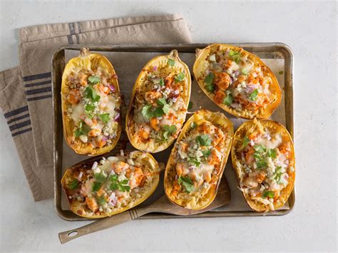 Try this surprisingly awesome low carb dish with homemade lower calorie ranch ! Buffalo Chicken Spaghetti Squash Boats