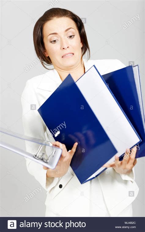 Business Woman With Too Many Folders Stock Photo Alamy